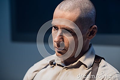 Portrait of a young handsome investigator in the interrogation room Stock Photo