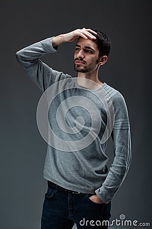 Portrait of young handsome male with beard wearing blouse Stock Photo