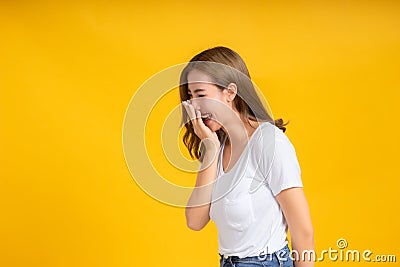 Portrait young happy asian woman smile laughing hand covering your mouth standing enjoy fun Stock Photo