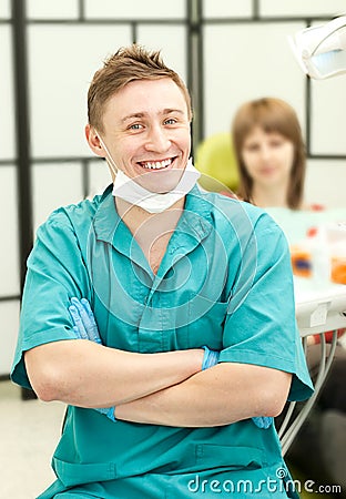 Portrait of young happy dentist in his surgery Stock Photo