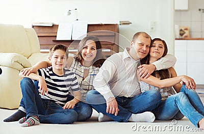 Portrait of young happy family with pretty teenager daughter and Stock Photo