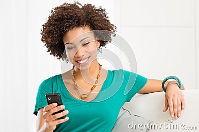 Young Woman Looking At Cellphone Stock Photo