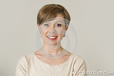 Portrait of young happy and pretty red hair woman on her 30s in Stock Photo