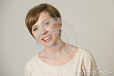 Portrait of young happy and pretty red hair woman on her 30s in sweet smile and positive face expression looking to camera isolate Stock Photo