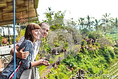 Portrait of young and happy romantic couple in balinese nature. Bali island. Stock Photo