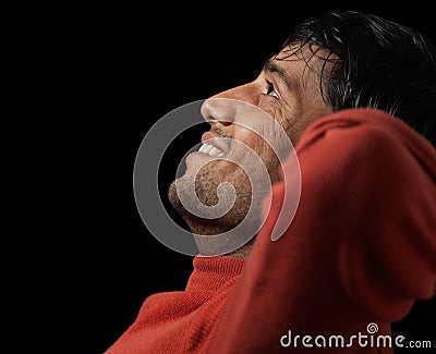Portrait of young Indian man smiling and relaxed Stock Photo