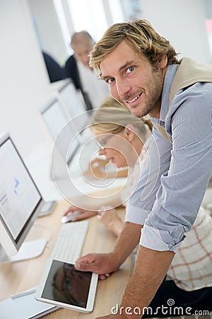 Portrait of young instructor in senior business class Stock Photo