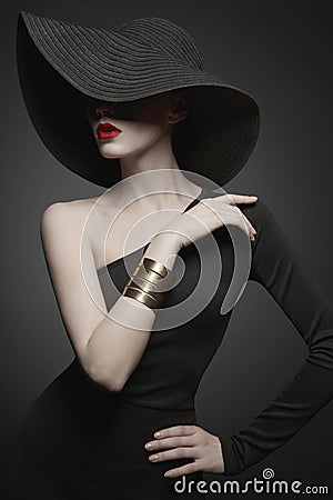 Portrait of young lady with black hat and evening dress Stock Photo