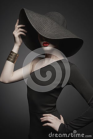 Portrait of young lady with black hat and evening dress Stock Photo