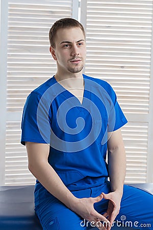 Portrait of a young male doctor in a medical office Stock Photo