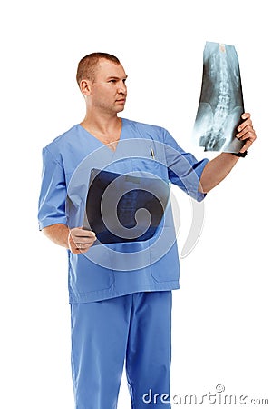 Portrait of a young male doctor in a medical surgical blue uniform against a white background Stock Photo