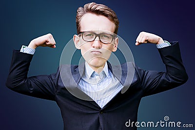 Young man with big head in suit flexing his muscles Stock Photo