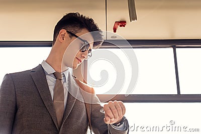 portrait of young man checking time while riding Stock Photo