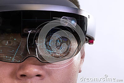 Portrait of young man with 3D virtual reality eye wear glasses hololens Stock Photo