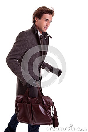 Portrait of a young man with a handbag, hasty Stock Photo