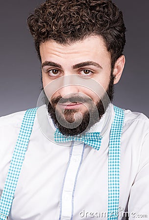 Portrait of a young man with a mysterious smile. Stylish white shirt Stock Photo