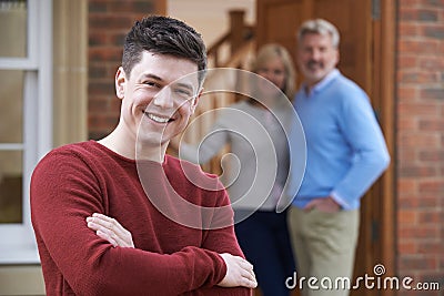 Portrait Of Young Man With Parents At Home Stock Photo