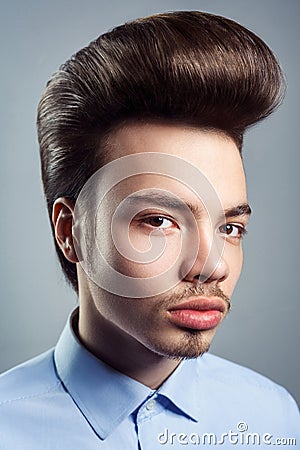 Portrait of young man with retro classic pompadour hairstyle Stock Photo