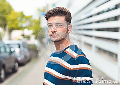 Portrait of young man in the street. Handsome guy Stock Photo