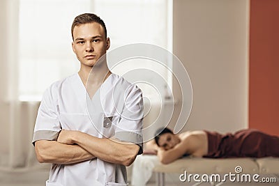 Portrait of a young masseur posing in his office Stock Photo