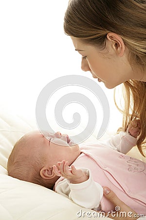 Young mother comforting a crying newborn baby Stock Photo