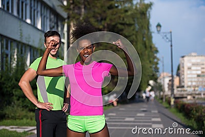 Portrait of young multietnic jogging couple ready to run Stock Photo