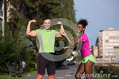 Portrait of young multietnic jogging couple ready to run Stock Photo