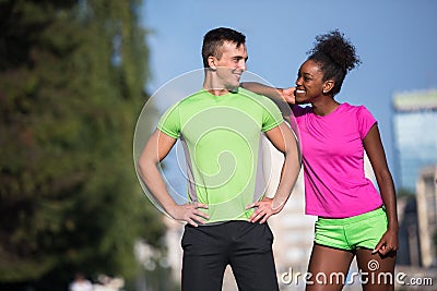 Portrait of young multietnic jogging couple ready to run Stock Photo