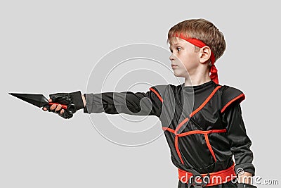 Boy training with kunai Stock Photo