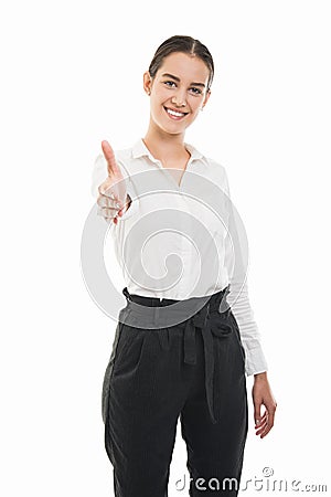 Young pretty bussines woman standing and offering handshake gesture Stock Photo