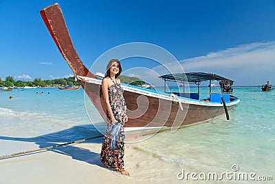 Portrait of young pretty woman at the turquoise sea beach Stock Photo