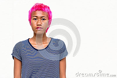 Young rebellious Asian woman with pink hair Stock Photo