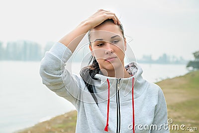 Portrait of a young sad woman with headache, fatigue or cold. D Stock Photo