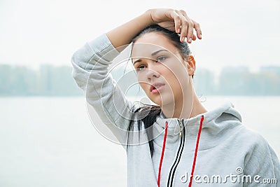 Portrait of a young sad woman with headache, fatigue or cold. D Stock Photo