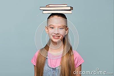 Portrait of a young schoolgirl with books Stock Photo