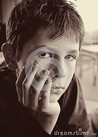 Portrait of young serious boy reflecting Stock Photo