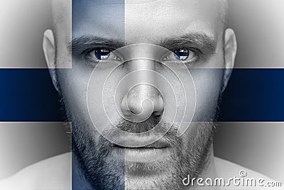 A portrait of a young serious man, in whose eyes are reflected the national flags Stock Photo