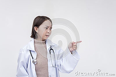 Portrait of a young and skilled doctor, medical student, intern scoldings someone. Isolated on a white background Stock Photo