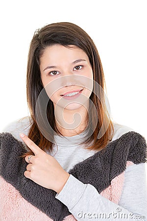 Portrait of young smiling woman pointing up looking in camera Stock Photo