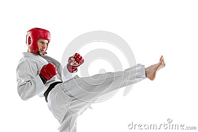 Portrait of young sportive man, taekwondo fighter wearing white dobok, helmet and gloves practicing isolated over white Stock Photo