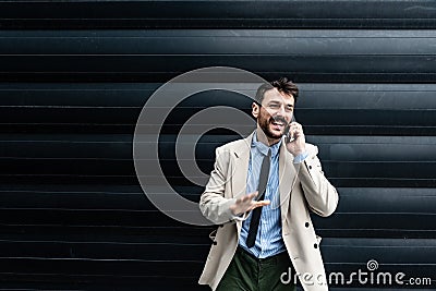 Portrait of a young successful businessman, sales manager, boss and foreman standing in front of an office building. Business Stock Photo