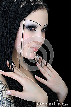 Portrait of young tattooed stylish woman Stock Photo
