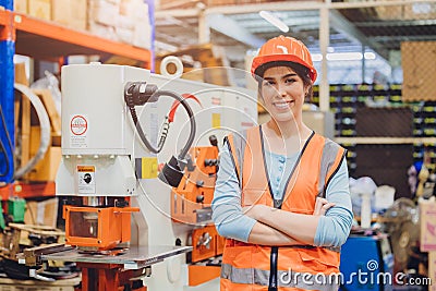 Portrait young teen Asian woman machine engineer working in heavy industry happy smiling confident Stock Photo