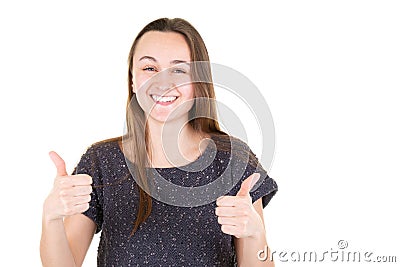 Portrait of young thumbs up woman looking in camera on white background Stock Photo