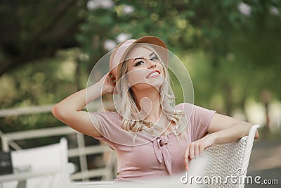 Portrait of a young woman, blonde, glasses, outdoors in the park Stock Photo