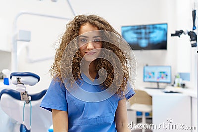 Portrait of young woman dentist at private dental clinic. Stock Photo