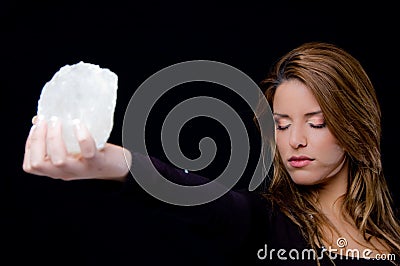 Portrait of young woman holding stone Stock Photo