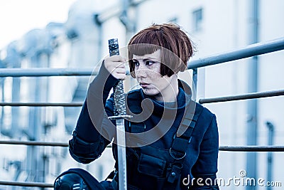Portrait of young woman with katana sword Stock Photo