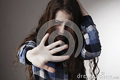 Sad woman scared putting hand in front of face Gestures, body l Stock Photo