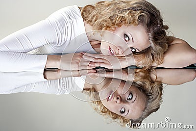 Portrait of young woman with a mirror Stock Photo